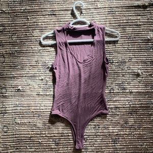 Purple turtle neck cut out body suit
